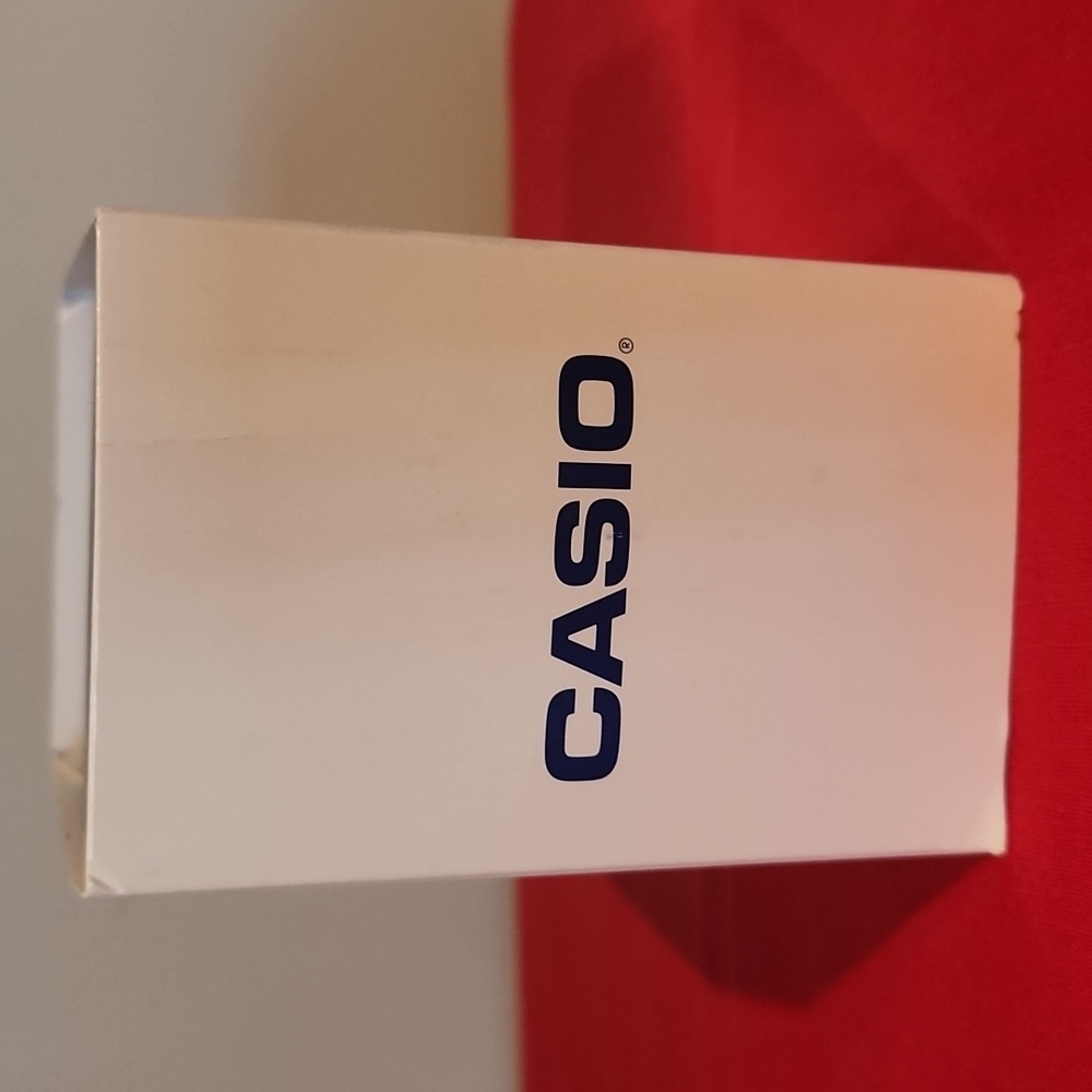 NWOT w/box and documents  CASIO Self Charging glow in the dark watch